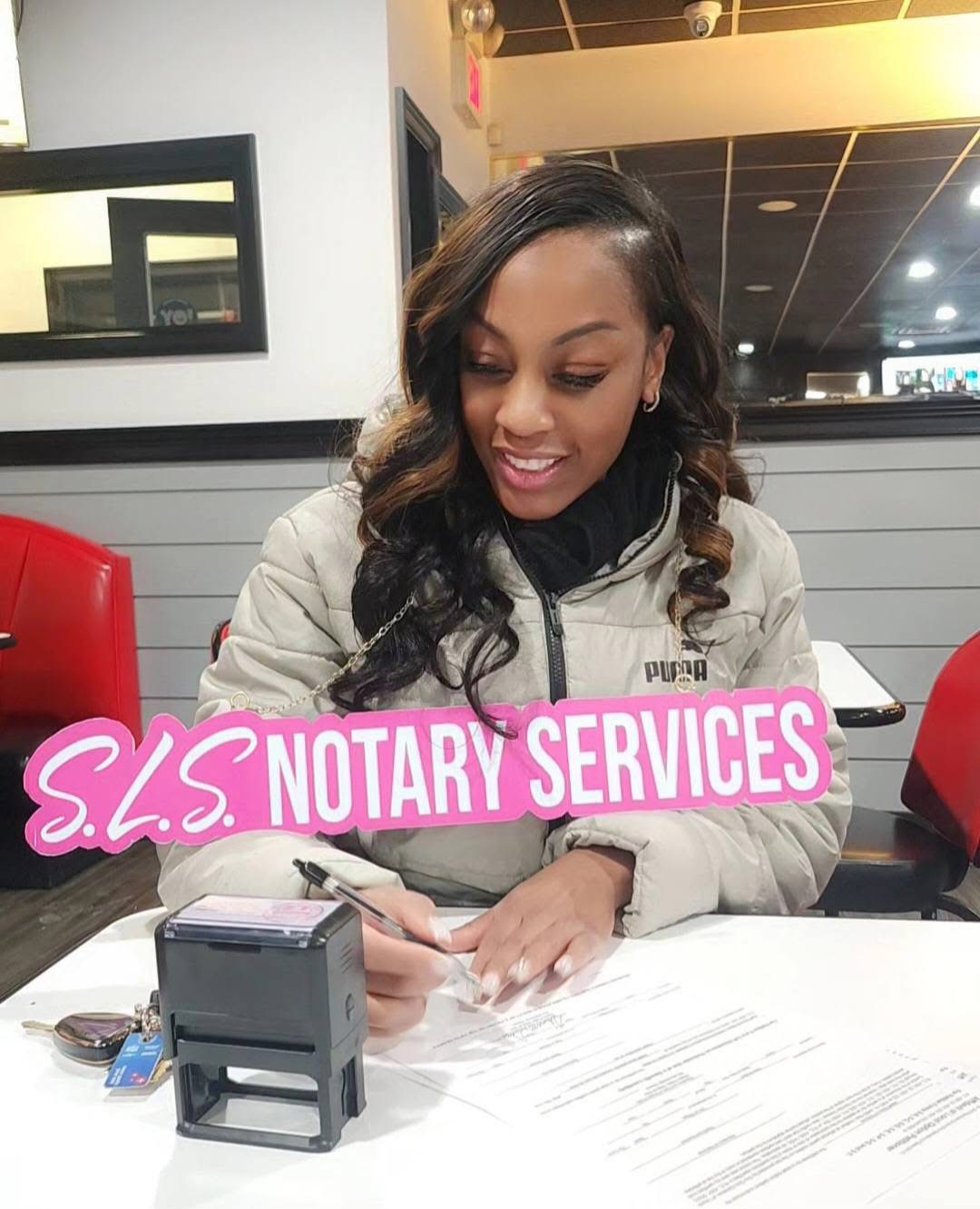 SLS Notary founder notarizing a document